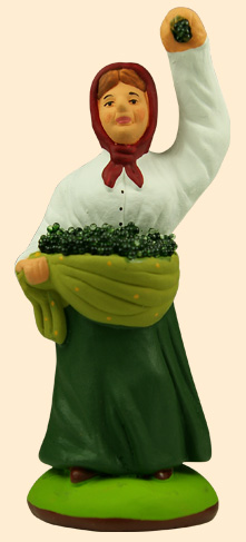 WOMAN GATHERING OLIVES