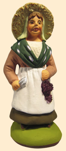 WOMAN HARVESTING GRAPES