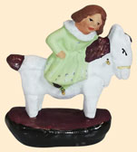 FILLETTE SUR CHEVAL À BASCULE