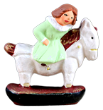 LITTLE GIRL ON ROCKING HORSE